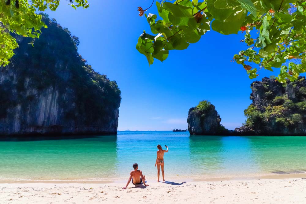 Couple on a beach taking a picture