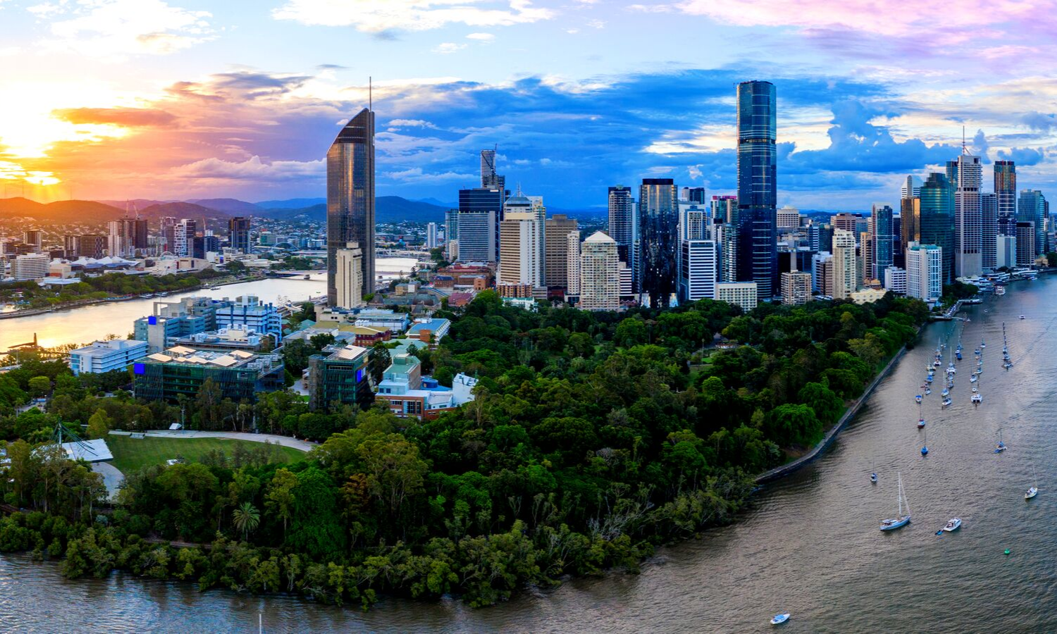 City scape of Brisbane. Shows city outline in front of some atmospheric clouds. 